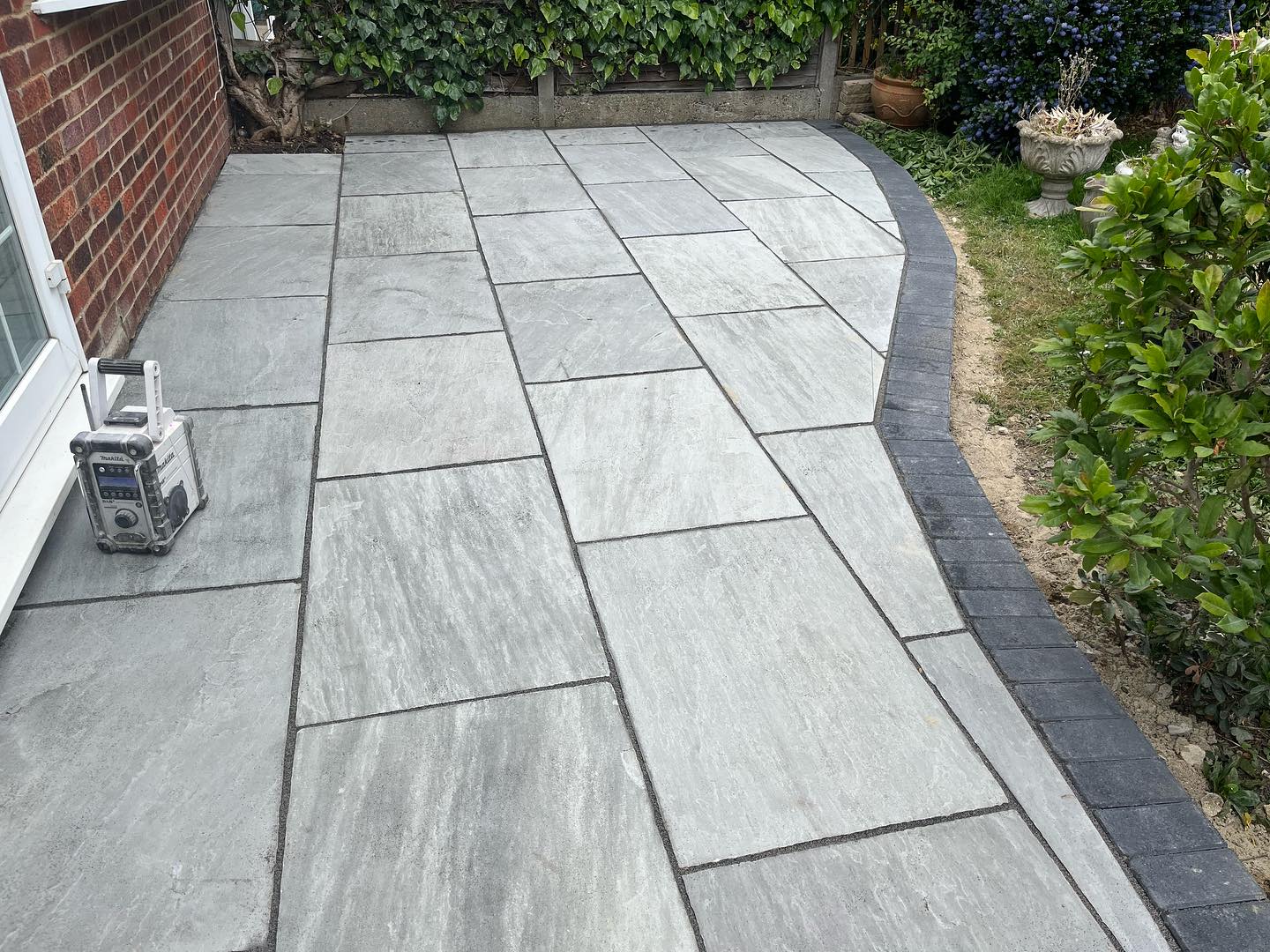 Precision porcelain patio installation completed by Tommy Daltrey - Daltrey Building Co